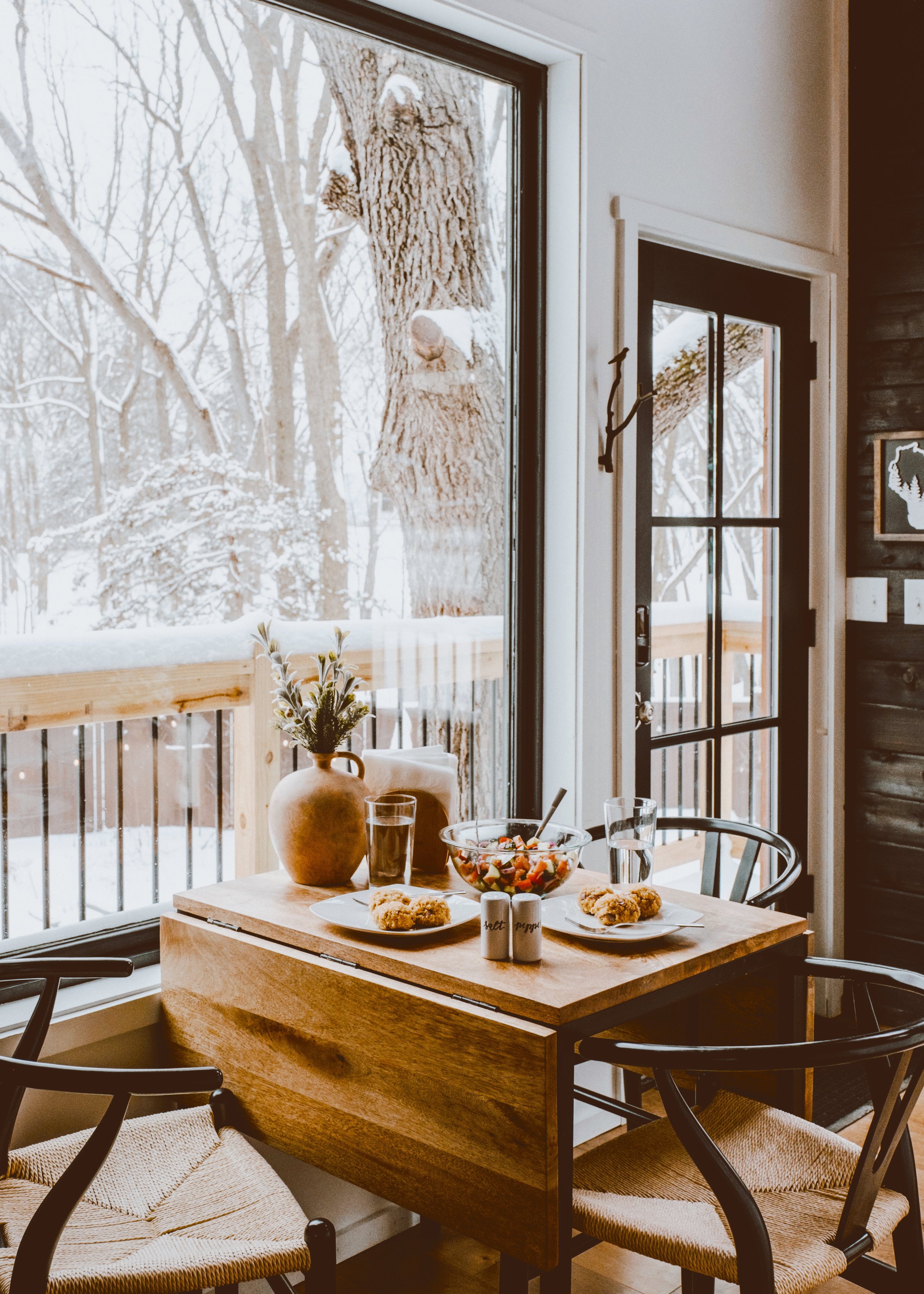breakfast in the treehouse on a snowy day with large windows